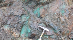 Photo 4: Extensive malachite staining in outcropping porphyritic rock.